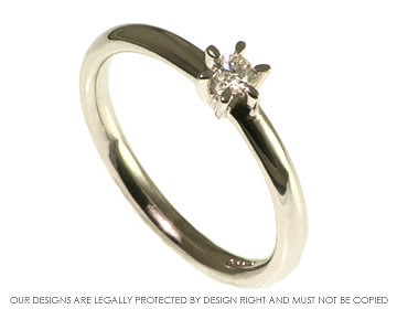 Daisy inspired white gold diamond solitaire engagement ring