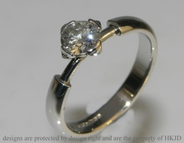 Platinum star inspired engagement ring with 0.58cts diamond.