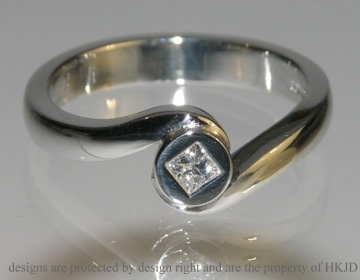 Platinum and diamond wave inspired engagement ring