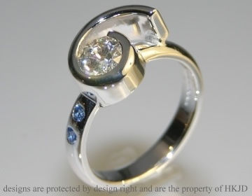 Bespoke 18ct white gold diamond and sapphire diamomd ring.