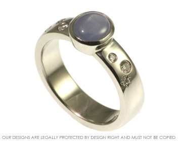 Platinum night sky star sapphire and diamond engagement ring