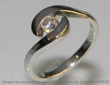 OLD PHOTO - 

Platinum swirl solitaire engagement ring with a 0.25ct  diamond 