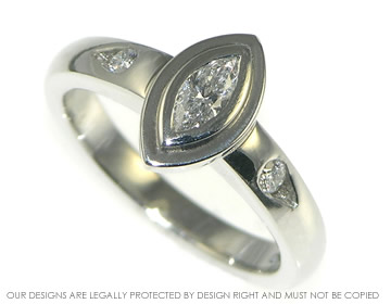 Platinum leaf inspired engagement ring with 0.19ct marquise shaped diamond.