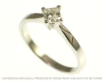 Kandinsky inspired angular lined diamond engagement ring. 