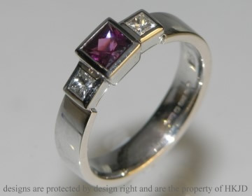 White gold 0.43cts rhodalite garnet and diamond engagement ring. 