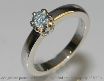 Platinum and 0.35cts brilliant cut heat-treated ice blue diamond engagement ring. 