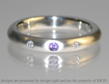 Platinum eternity ring with amethyst and diamond 