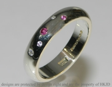 Bespoke 9ct white gold wedding ring with Sapphires and diamonds. 