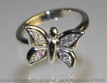 Butterfly inspired diamond and pink sapphire engagement ring 