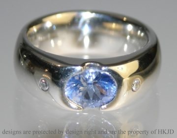 Bespoke platinum and blue sapphire engagement ring 