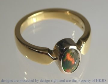 18ct white and yellow gold dress ring with oval black opal