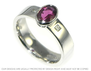 White gold ring with red tourmaline and side diamonds