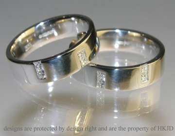 Platinum commitment rings each with four HSI princess cut 2mm diamonds 