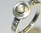 9ct white gold eternity ring with 0.22ct moonstone and 2 2mm sapphires and 2 1.5mm diamonds star set