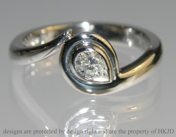 Platinum wave inspired  engagement ring 