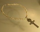 cross pendant on a fully strung ivory pearl necklace