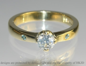 18ct yellow gold, diamond and blue topaz engagement ring