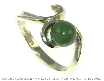 A delicate 9ct white gold leaf inspired jade ring