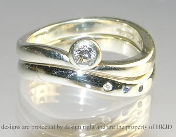 White gold diamond and sapphire countryside inspired engagement and wedding ring set.