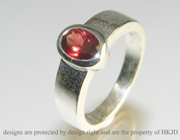 Chunky silver and garnet ring.