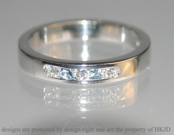 Bespoke 9ct white gold eternity ring with aquamarines and diamonds