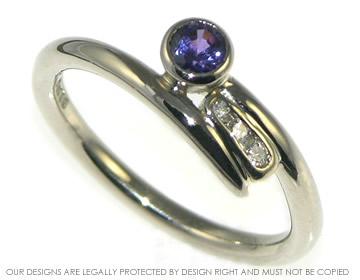 18ct night sky inspired ring with a brilliant cut violet sapphire. 