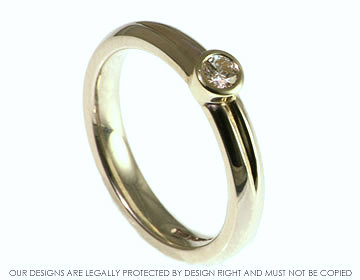 9ct white gold engagement ring with brillaint cut diamond and engraved groove.