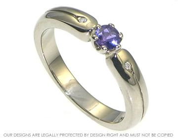 Violet sapphire and diamond engagement ring in 18ct white gold.