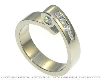 An 18ct white gold rolling wave inspired diamond engagement ring