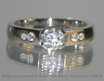 Platinum engagement ring with 0.50ct G VS brilliant cut central diamond with side diamonds