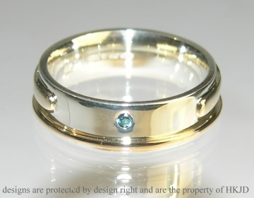 Bespoke 9ct white and  yellow gold wedding ring with blue topaz