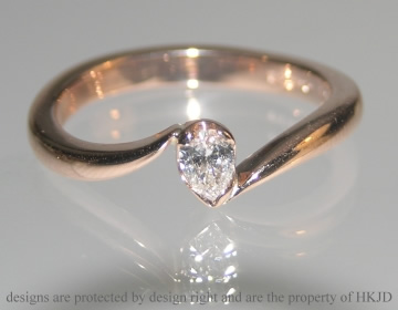 9ct rose gold and 0.11ct HSI pear shape diamond engagement ring