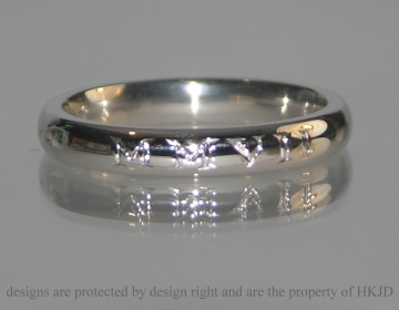 Bepoke engraved platinum wedding ring