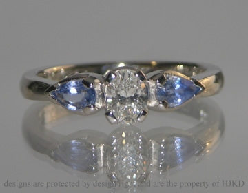 Platinum diamond and sapphire ski and colour inspired engagement ring