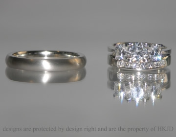 A platinum and diamond shaped wedding ring   