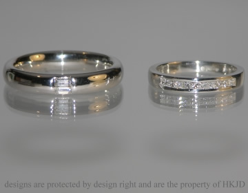 Pair of platinum wedding bands with diamonds