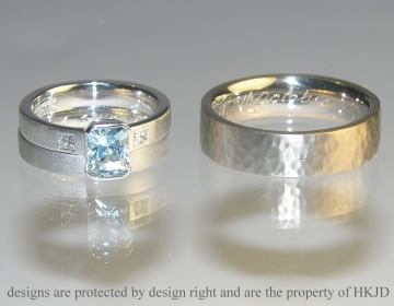 A pair of white gold wedding bands