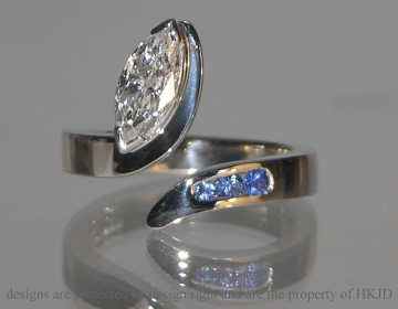 18ct white gold ring with marquise cut diamond and  blue sapphires 