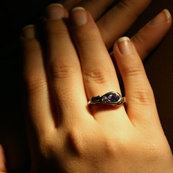 18ct white gold flower inspired diamond and lilac sapphire ring