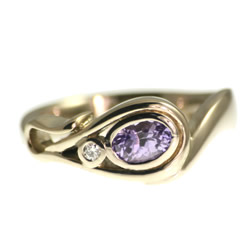 18ct white gold flower inspired diamond and lilac sapphire ring