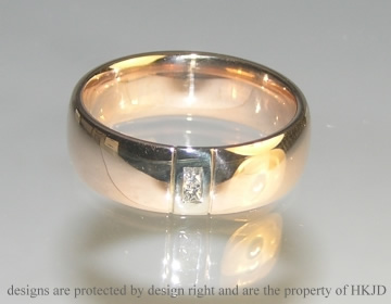 18ct white and rose gold wedding ring with channel set princess cut diamonds