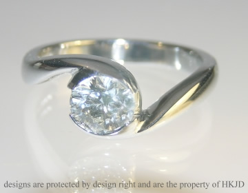 Bespoke platinum engagement ring incorporating customers own brilliant cut 0.89ct diamond.