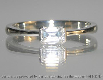 Platinum 0.44cts emerald cut diamond engagement ring. 