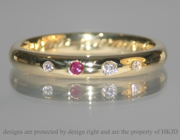 Bespoke 18ct yellow gold eternity ring with ruby and diamonds.