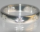 platinum eternity ring with seven 2mm hsi diamonds star set around the ring