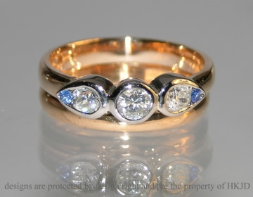 18ct rose and white gold dress ring using customers own diamonds and two 1.5mm sapphire 