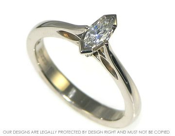 An 18ct white gold and marquise diamond solitare engagement ring