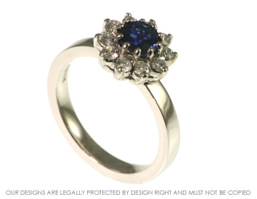 Platinum engagement ring with a brilliant cut blue sapphire and 10  brilliant cut diamonds