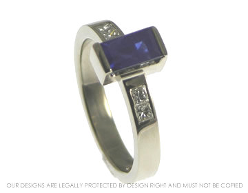 18ct white gold engagement ring with a blue sapphire and two  diamonds. 