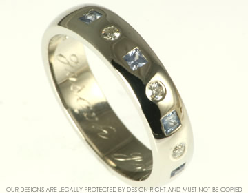 Platinum eternity ring with four invisibly set blue sapphires  